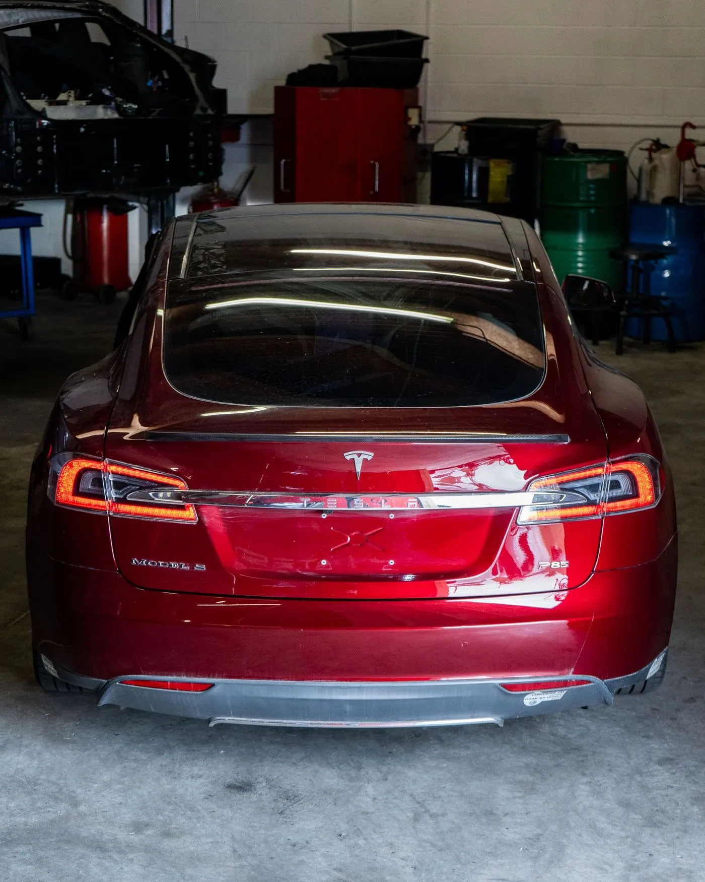 Tail lights of a red Tesla Model S