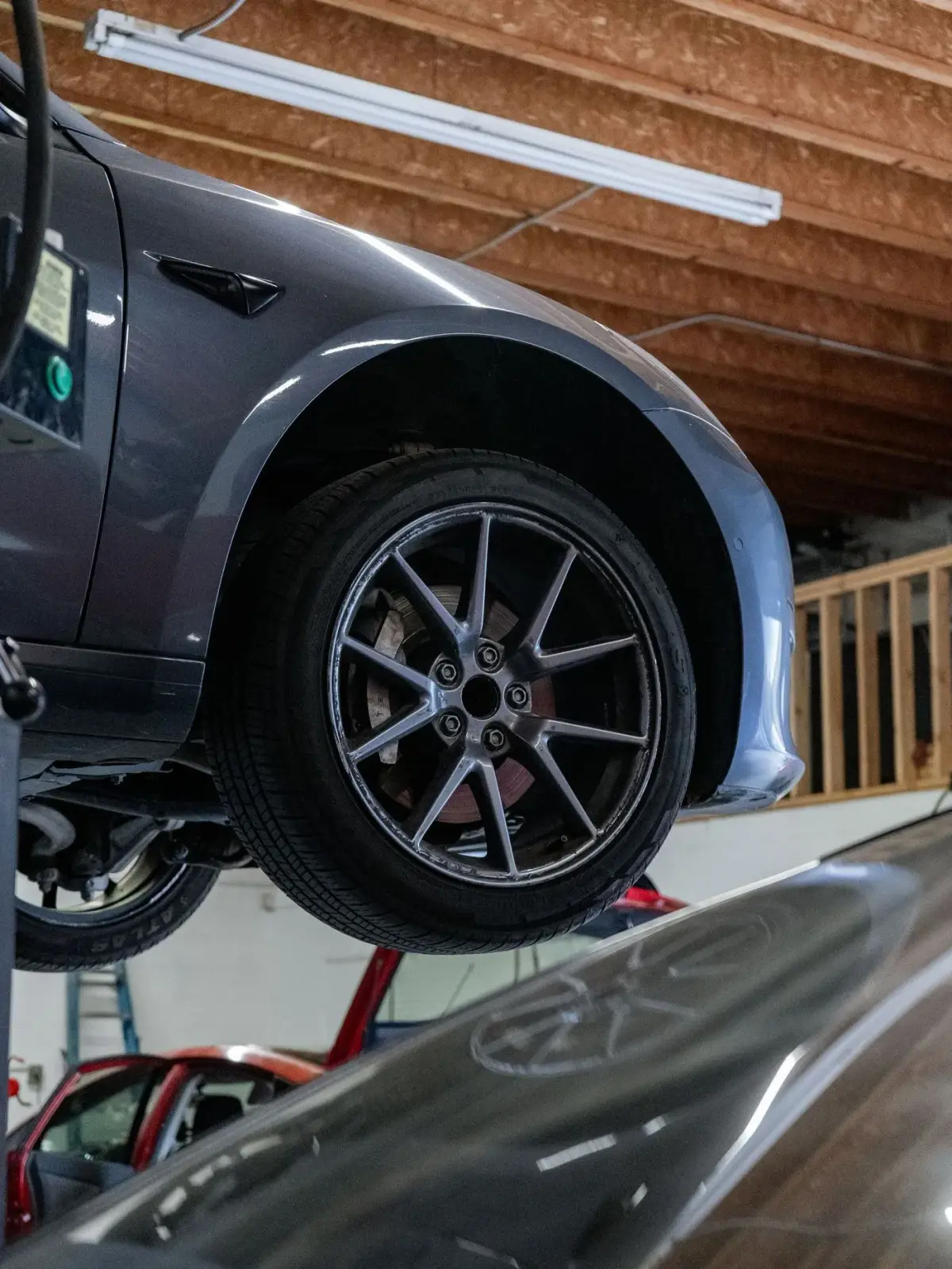 Tesla wheel and brake on the lift during service