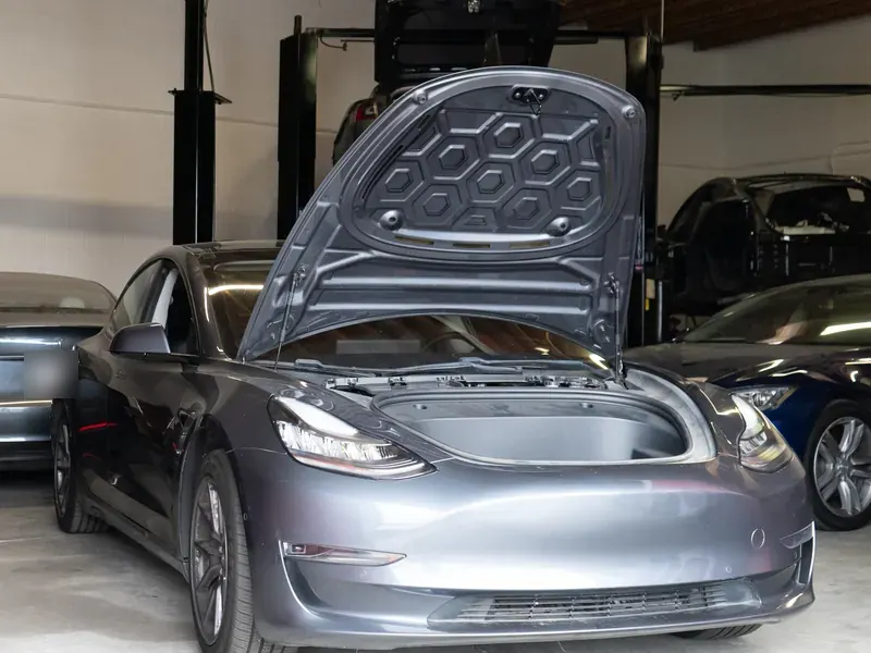 Gray Tesla Model 3 with the frunk open at Electric City SoCal