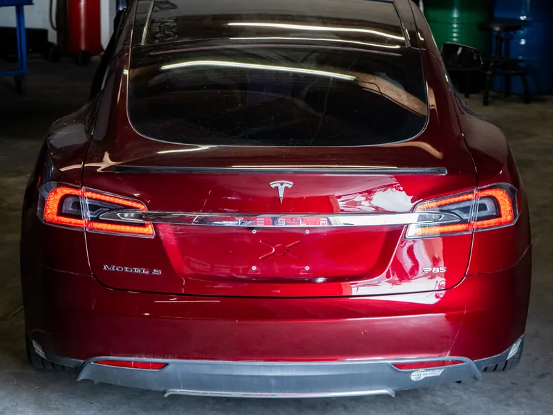 Red Tesla Model S in the Electric City SoCal shop
