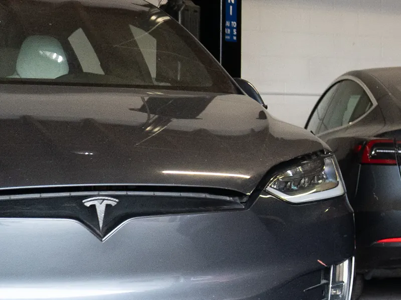 Gray Tesla Model X in the Electric City SoCal shop